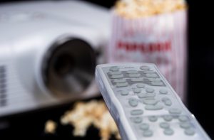 Remote Control with Beamer and Popcorn in the background